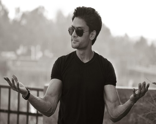 Portrait of young indian man smiling